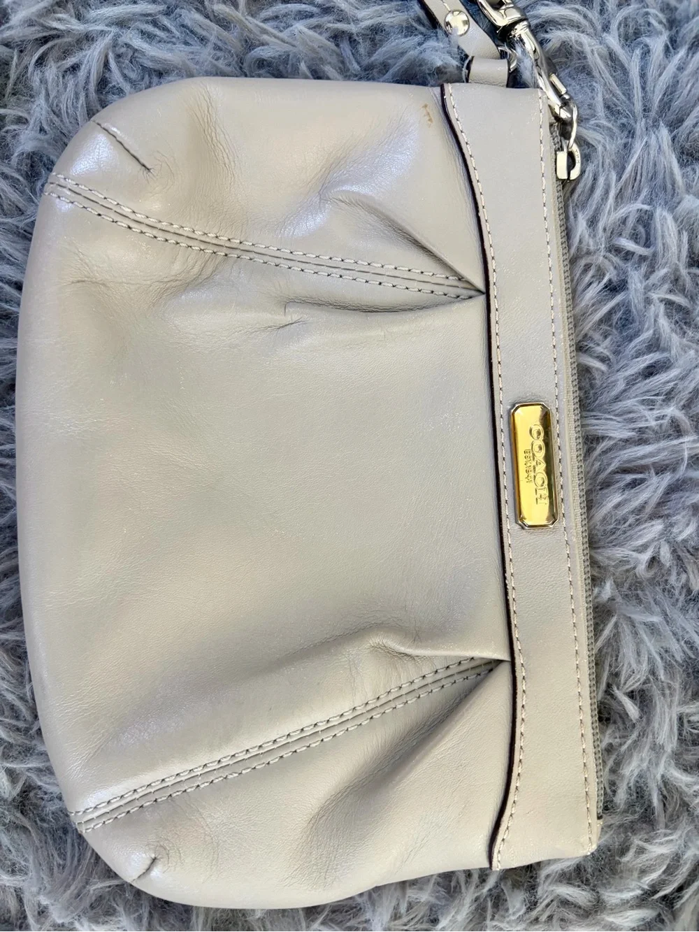 Coach ivory leather wristlet clutch with gold logo baby blue inside